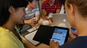 students studying with ipad and laptop